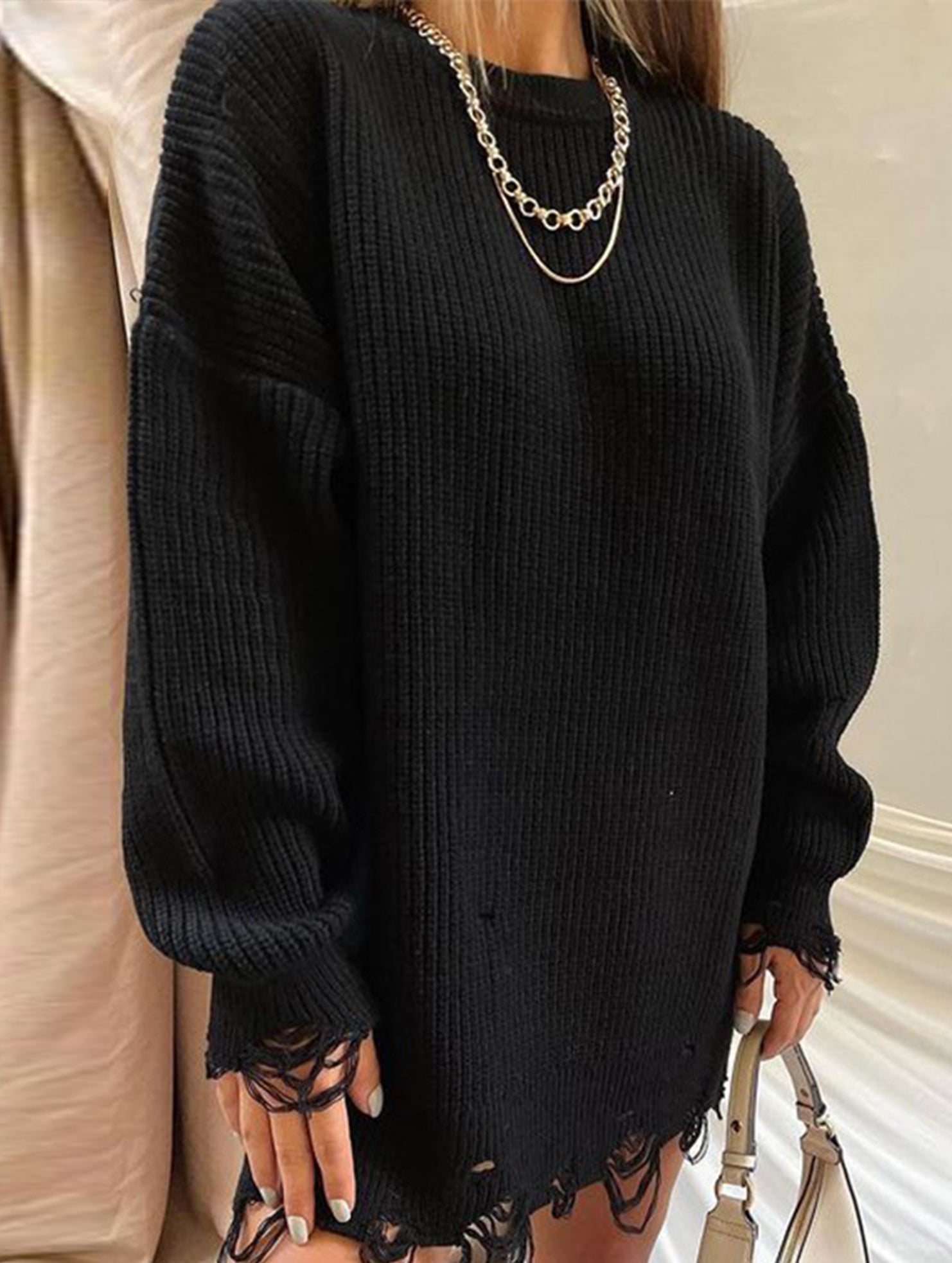 Round neck and ripped hem loose knit sweater