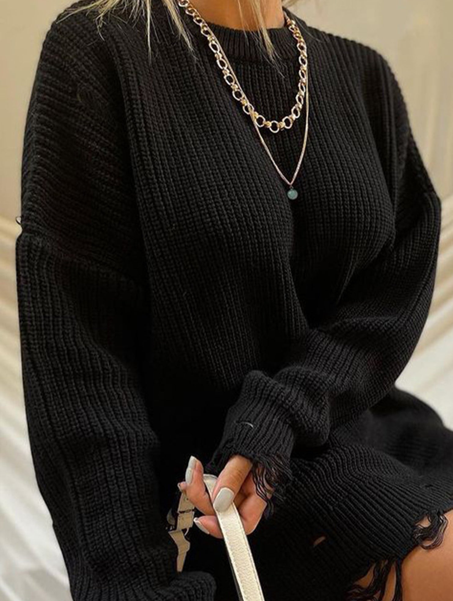 Round neck and ripped hem loose knit sweater