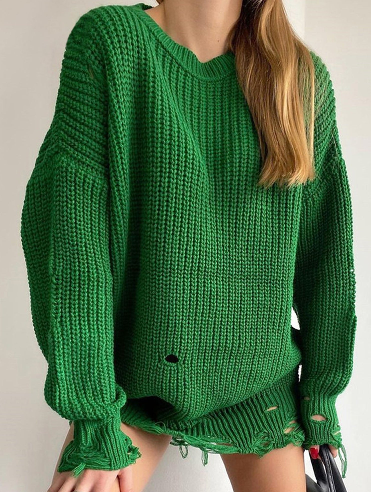 Round neck and ripped hem loose knit sweater