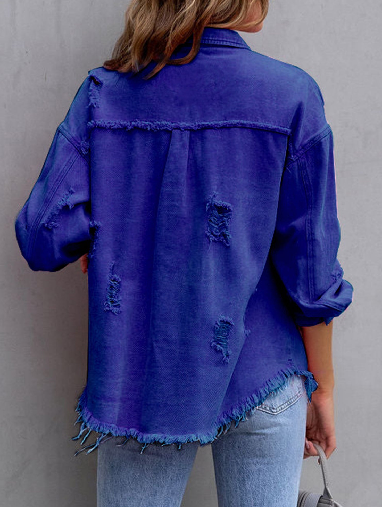 Old solid color denim coat with lapel and ripped raw edge