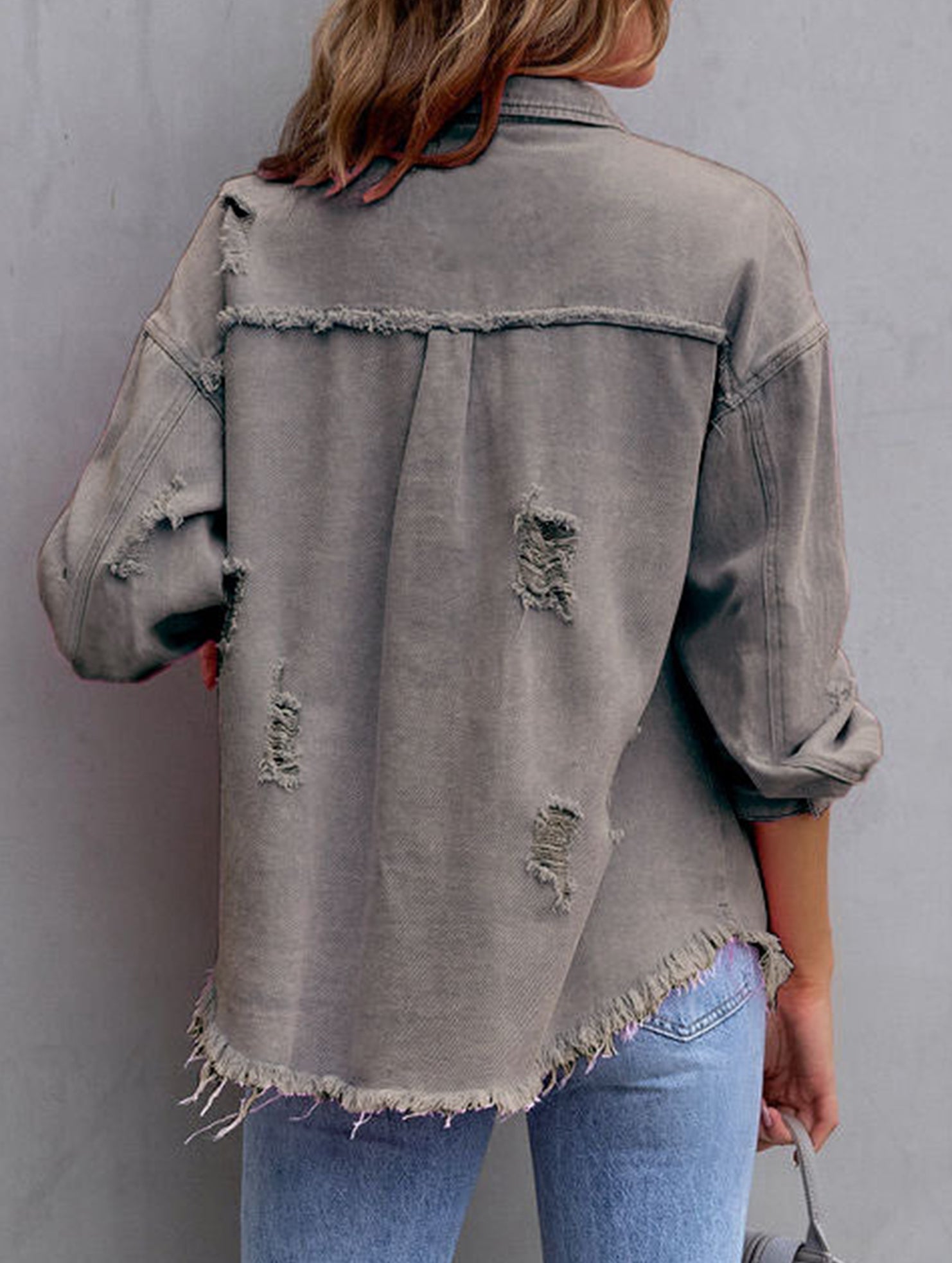 Old solid color denim coat with lapel and ripped raw edge