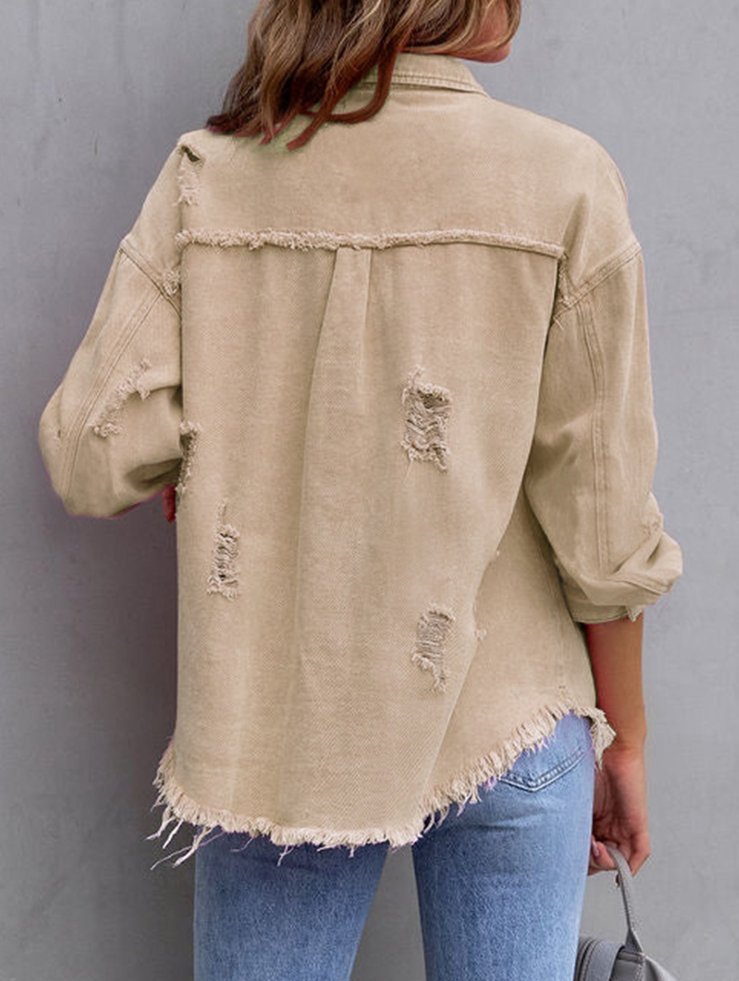 Old solid color denim coat with lapel and ripped raw edge