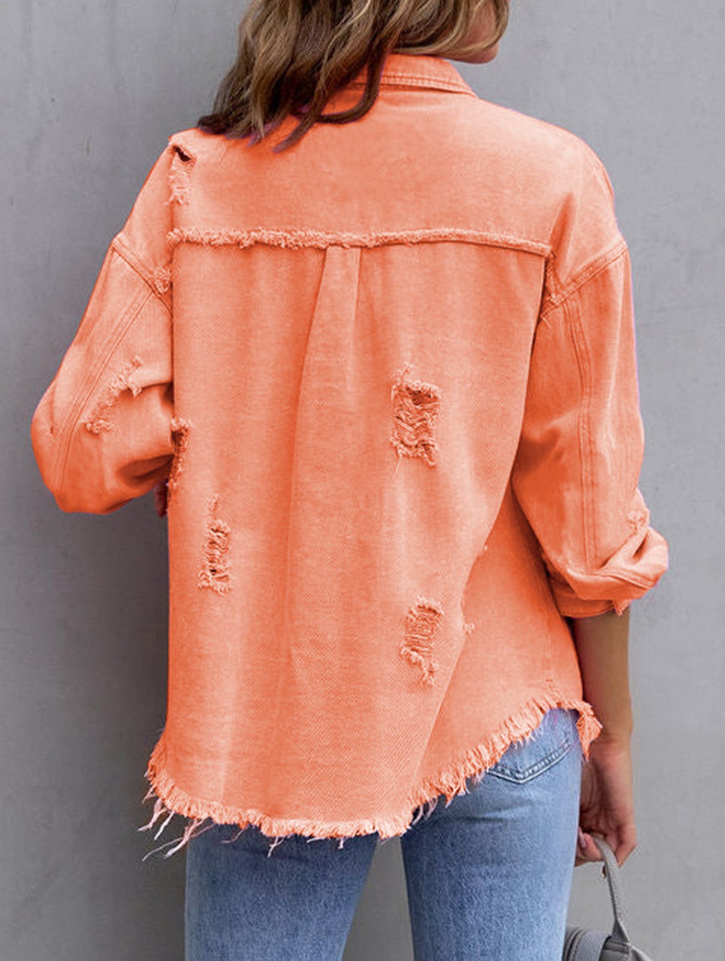 Old solid color denim coat with lapel and ripped raw edge