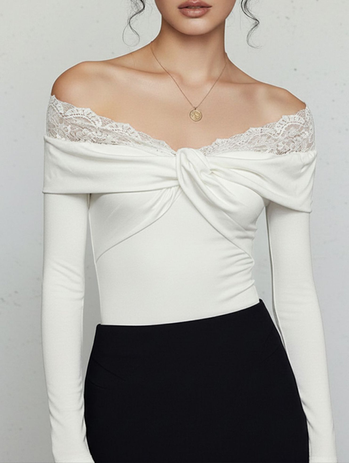 Lace-trimmed knotted off-shoulder bodysuit