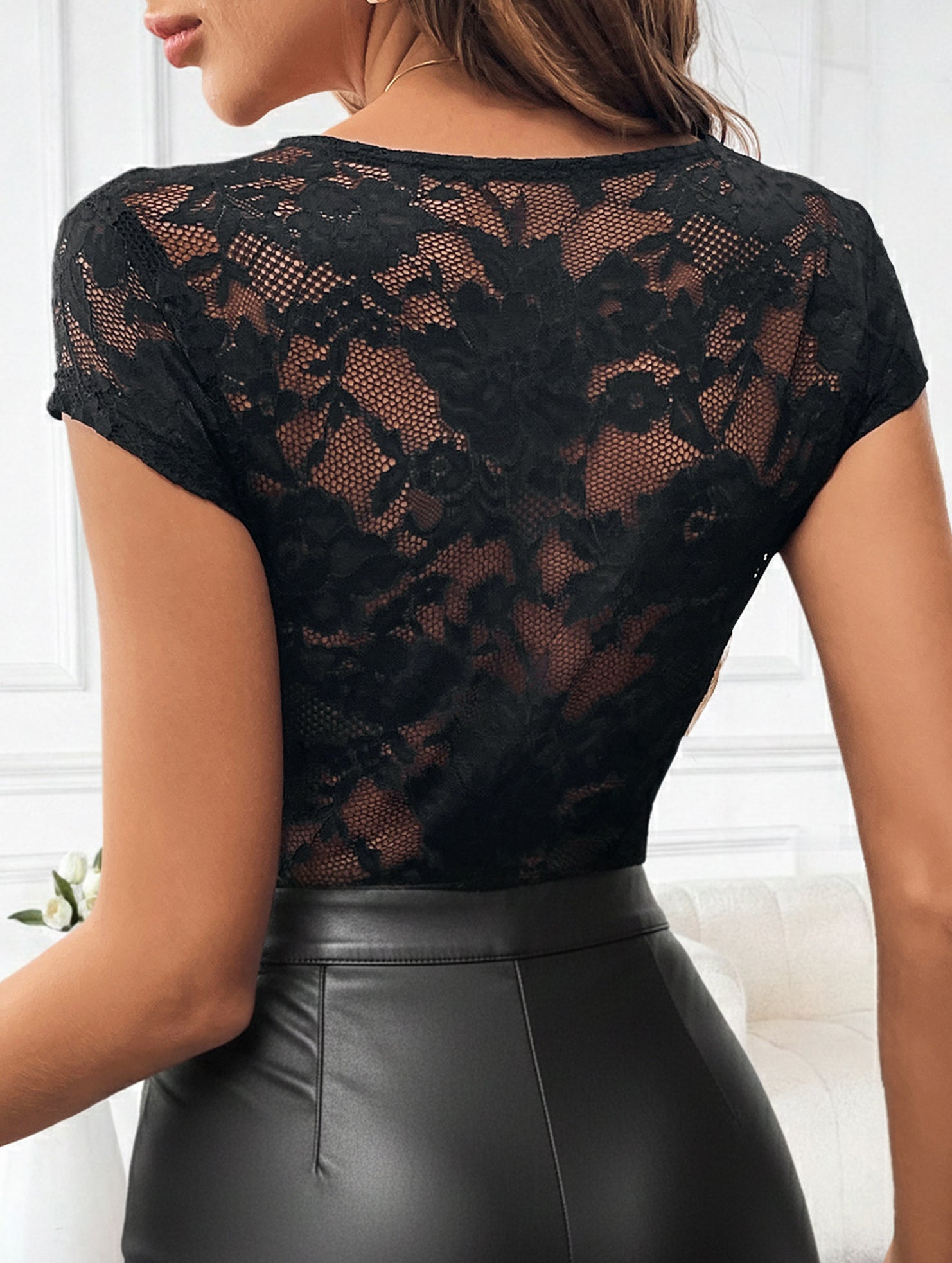 Fitted bodysuit with lace trim and ruffled collar