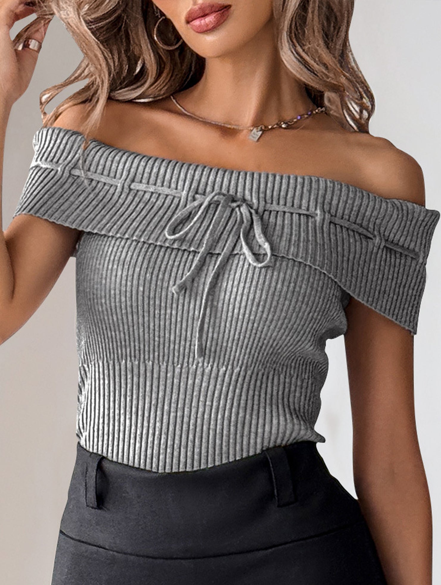 Women's Knit Top with Bow Tie Design