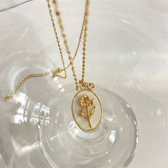 DECEMBER THREE DIMENSIONAL FLORAL OVAL NECKLACE_CWAJE1614