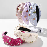 SOLID COLOR BUTTERFLY PEARL WIDE BRIM HEADBAND_CWAHA2605