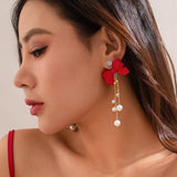 RED BOW EARRINGS WITH PEARL TASSELS_CWAJE1138