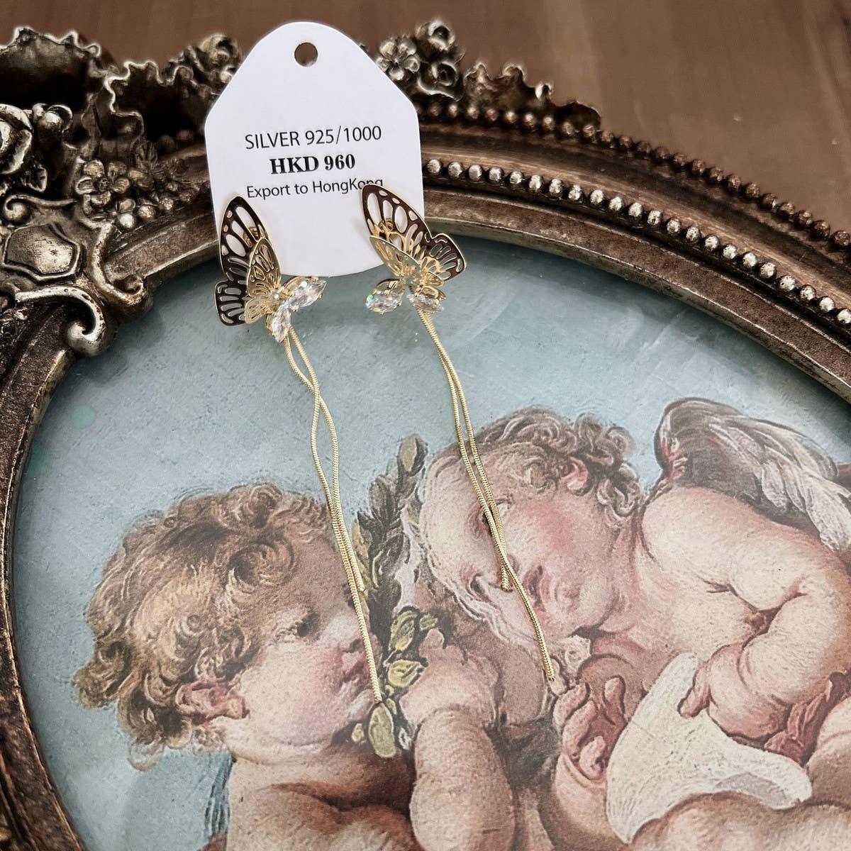 HOLLOW BUTTERFLY TASSEL EARRINGS_CWAJE1287