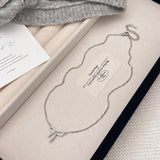 MICRO PAVED ZIRCONIA PEARL BOW PENDANT NECKLACE_CWAJE3059