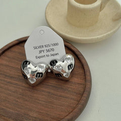 HALF FACE THREE DIMENSIONAL EARRINGS_CWAJE1345