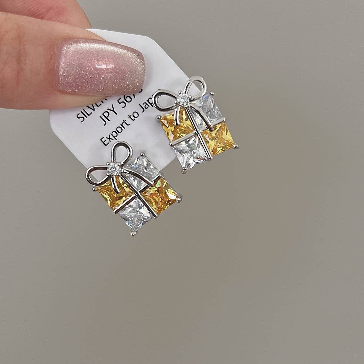 SQUARE ZIRCONIA BOW EARRINGS AND EARRINGS_CWAJE2029