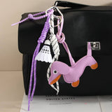 CUTE LEATHER DACHSHUND BAG CHARM WITH SHUTTLECOCK_CWMM7565