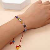 MIXED COLOR GLASS DISC EYE SMALL TASSEL BRACELET_CWMM3855