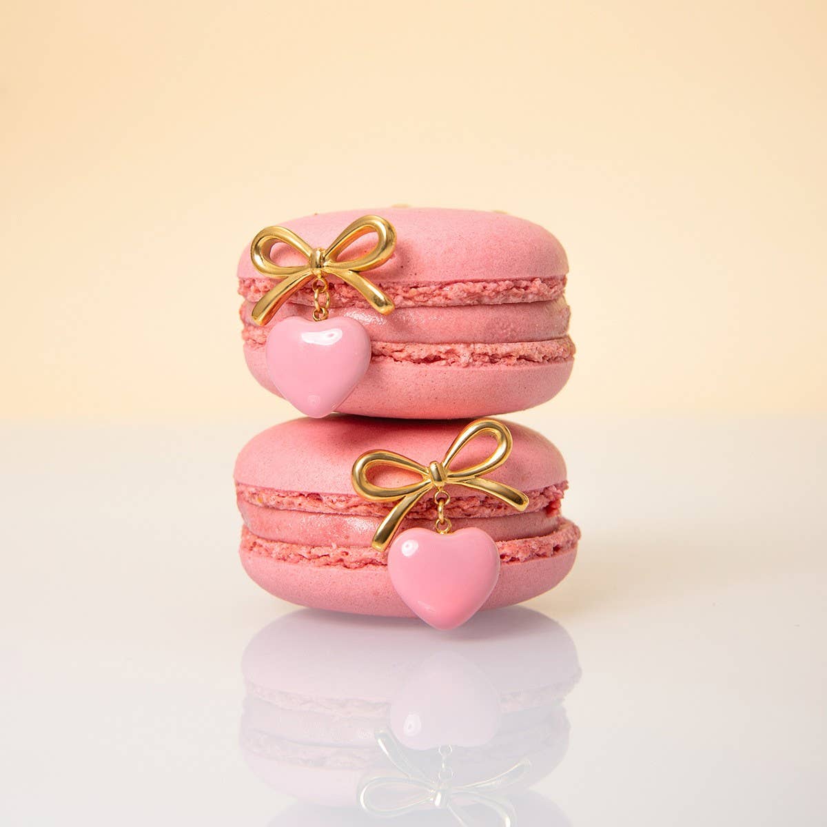 BOW WITH A HEART SHAPED OIL DROP EARRINGS_CWAJE1881