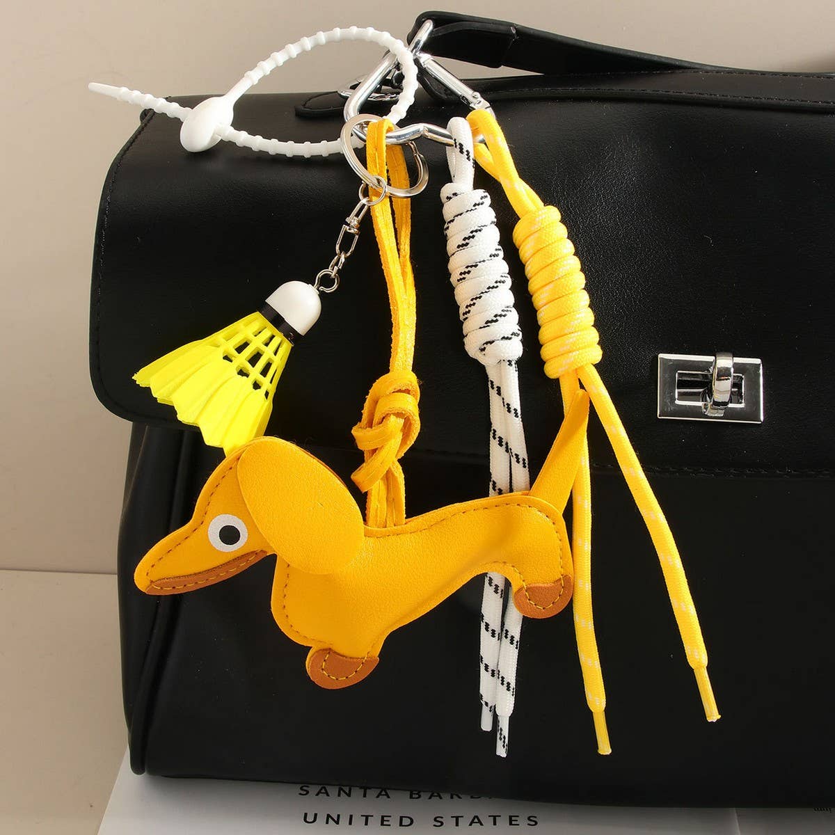 CUTE LEATHER DACHSHUND BAG CHARM WITH SHUTTLECOCK_CWMM7565