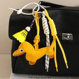 CUTE LEATHER DACHSHUND BAG CHARM WITH SHUTTLECOCK_CWMM7565