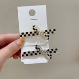 BLACK AND WHITE CHECKERBOARD PEARL BOW HAIRPIN_CWAHA4776