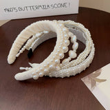 RETRO LOVE TWIST PEARL HEADBAND_CWAHA0829