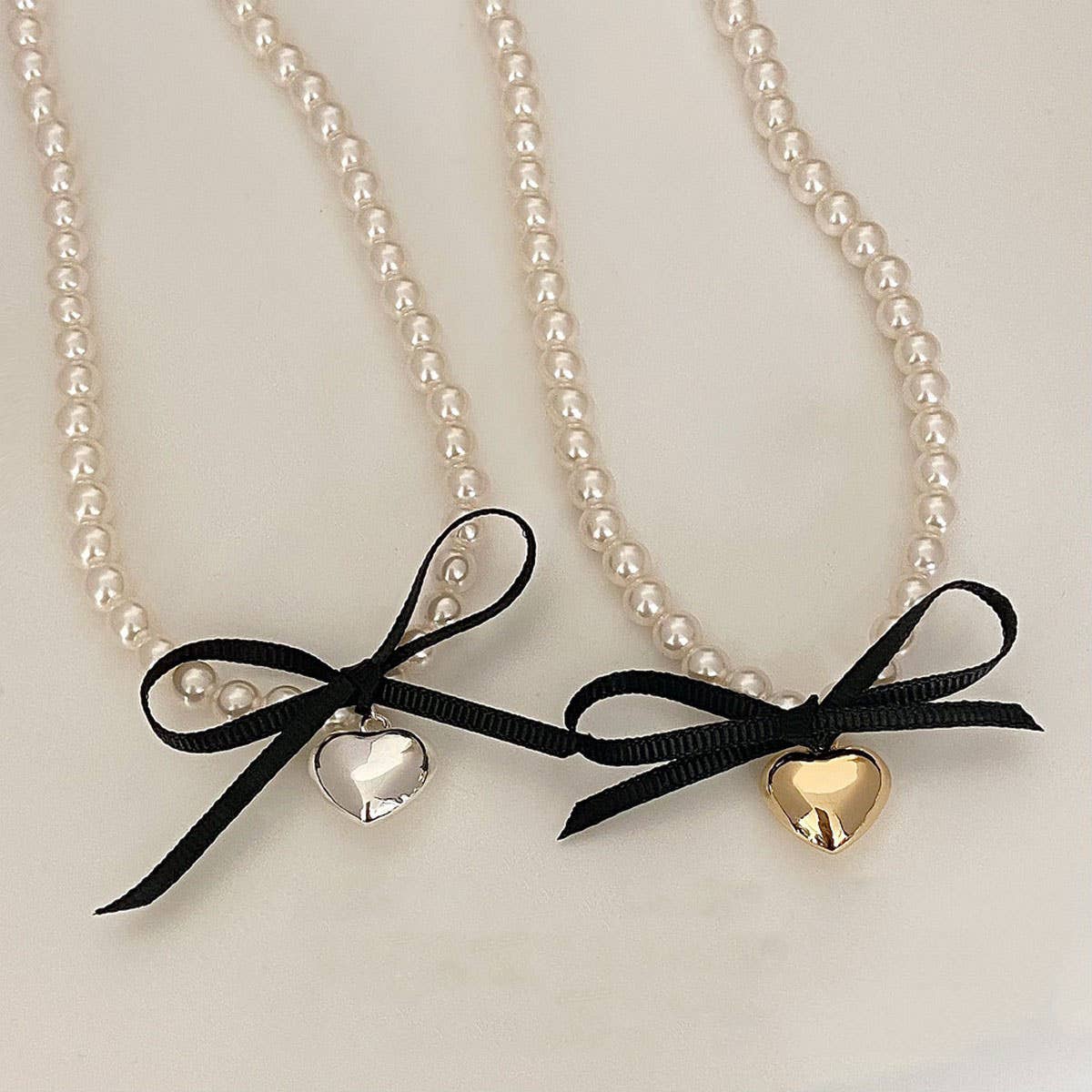 BOWKNOT DOUBLE PEARL HEART PENDANT NECKLACE_CWAJE3080