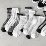 BLACK AND WHITE JACQUARD TRANSPARENT MID TUBE SOCKS_CWMS0414