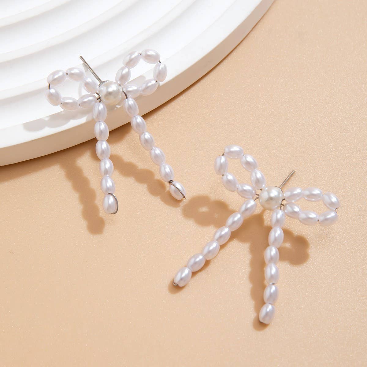 BOW FRENCH TASSEL PEARL EARRINGS_CWAJE1156