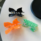 GLOW SKULL PUMPKIN ACETATE HAIR CLAW 8 3CM CLIP_CWASC1590