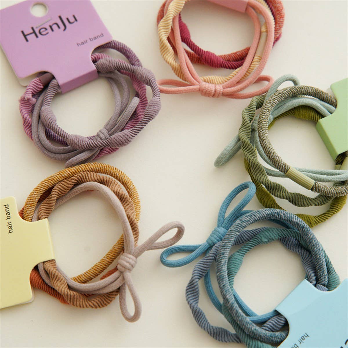4 PIECES OF CANDY COLORED SIMPLE HAIR TIES_CWAHA1130