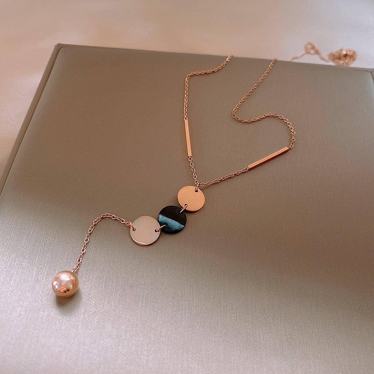 GEOMETRIC SEQUIN TASSEL NECKLACE_CWAJE2370