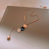 GEOMETRIC SEQUIN TASSEL NECKLACE_CWAJE2370